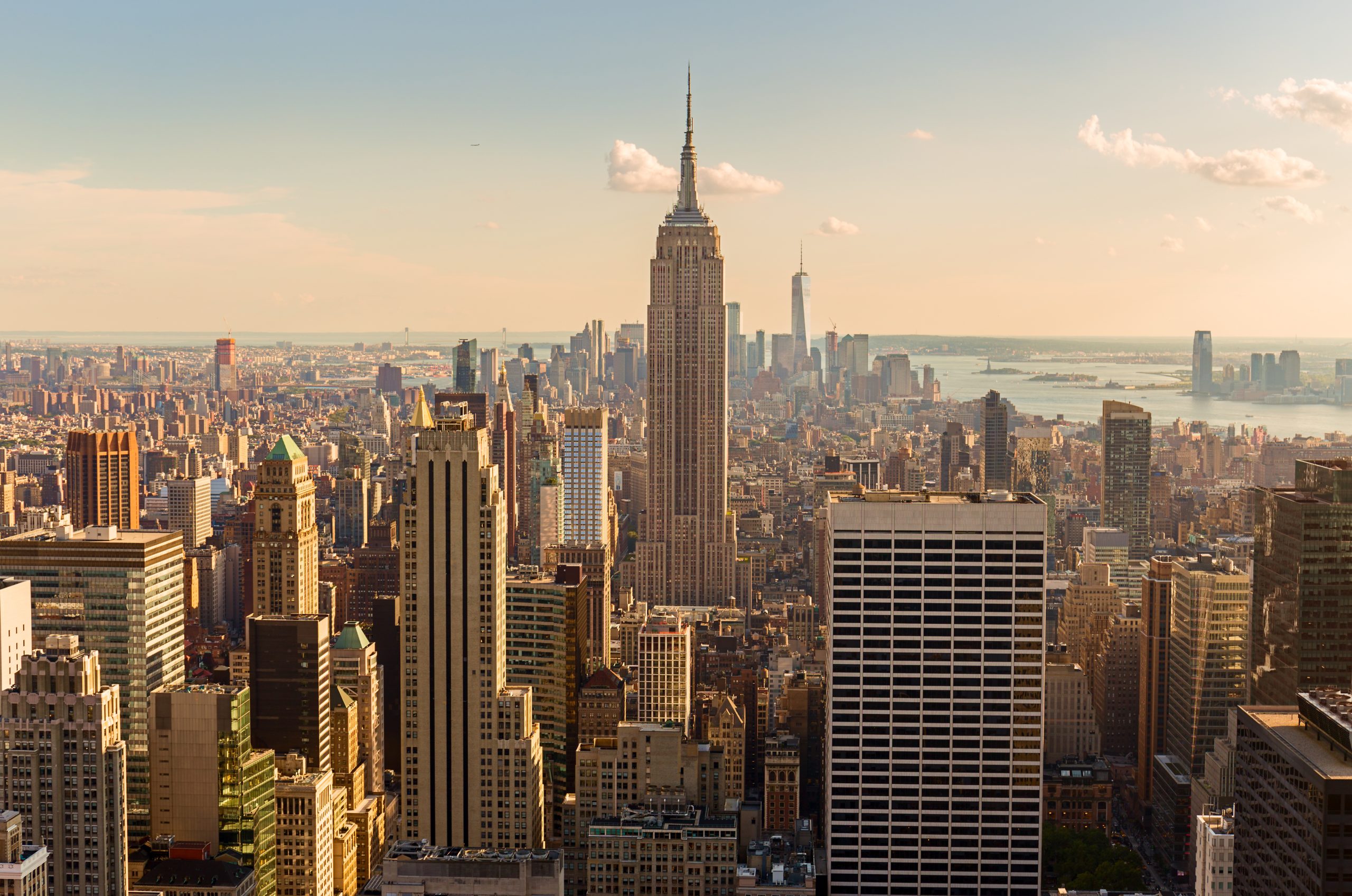 Manhattan Midtown Skyline with illuminated skyscrapers at sunset. NYC, USA