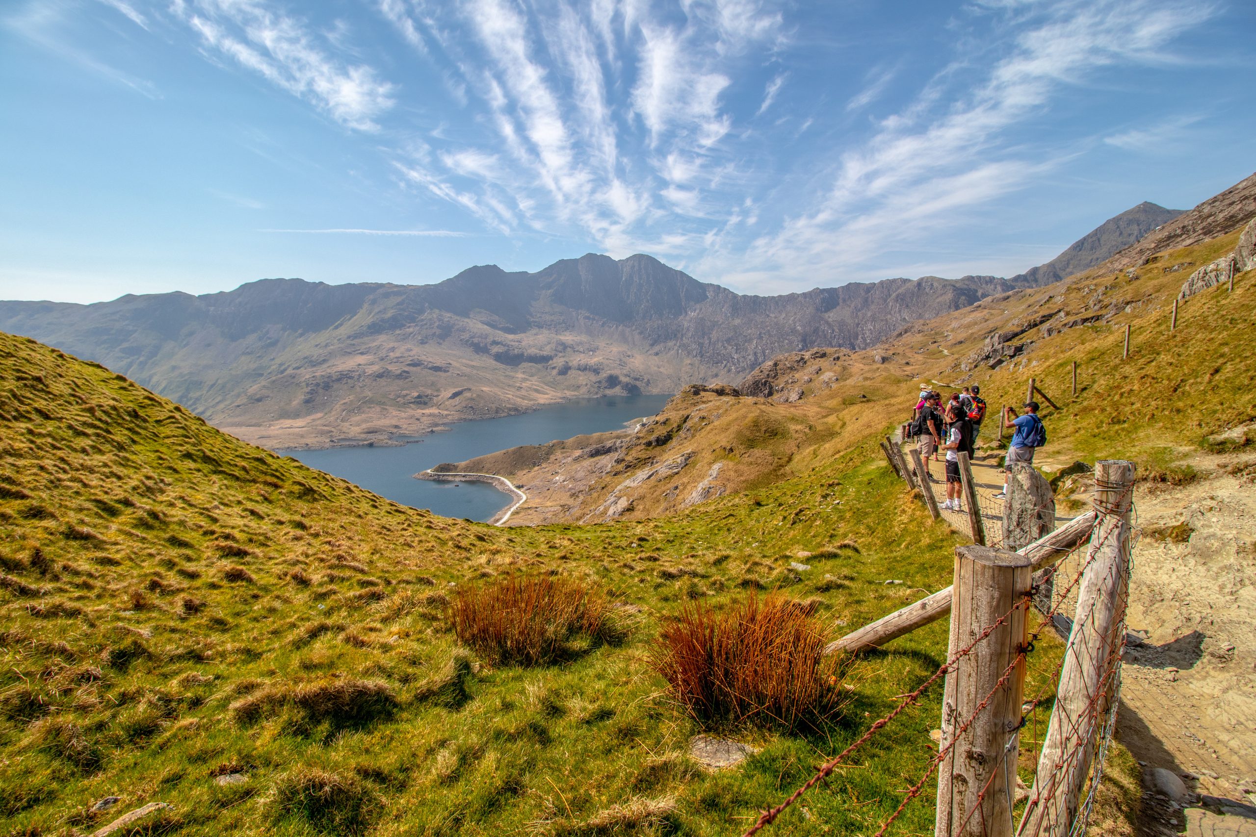 Snowdonia,Wales, UK. Tourist hiking at Snowdon mountain landscape. Snowdon mountain landscape is located in Snowdonia National Park,Wales, United Kingdom.