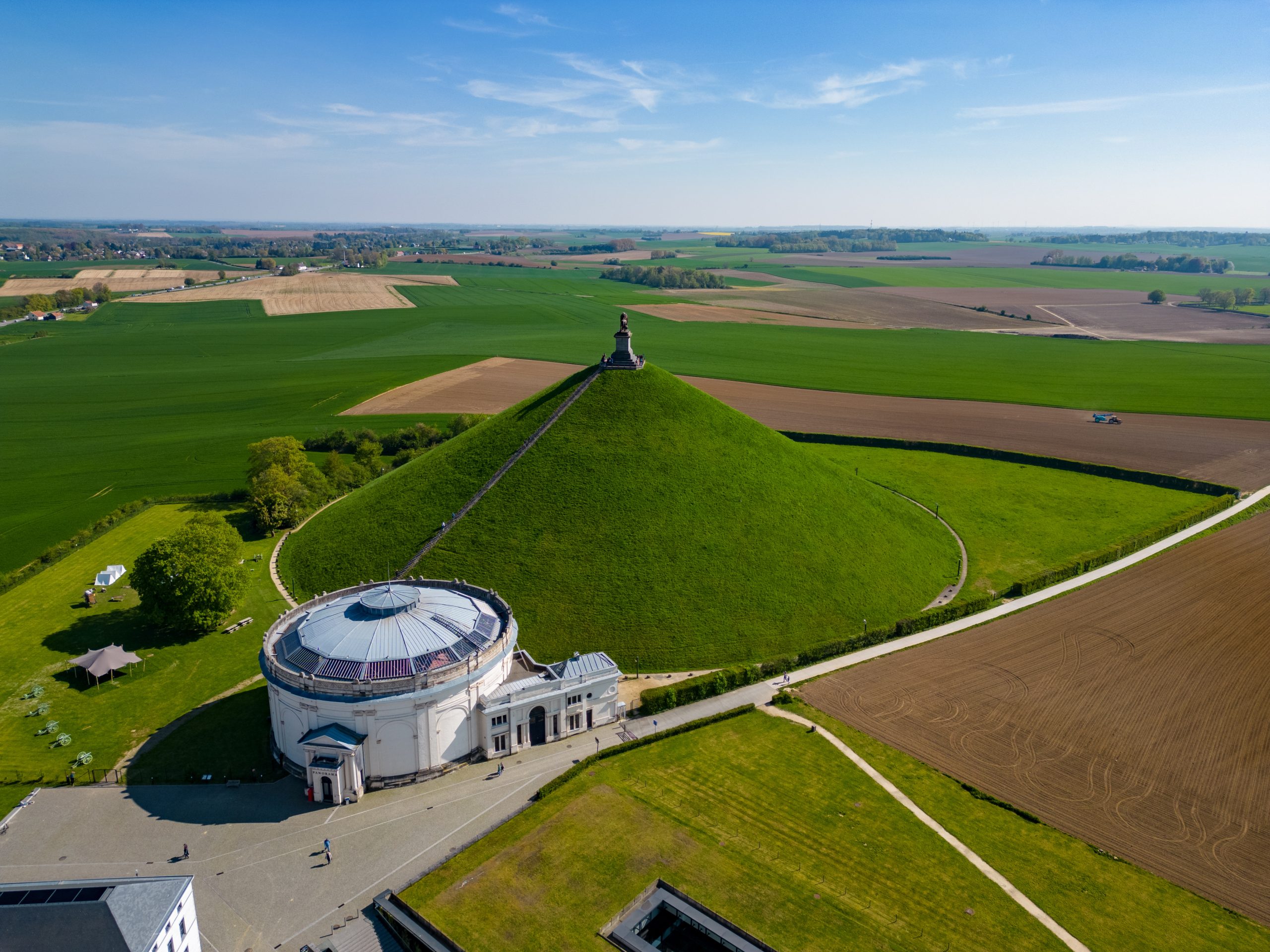 Aerial View at the Waterloo Hill with the statue of the lion of Memorial Battle of Waterloo, Belgium. Aerial landscape view shot by a drone.