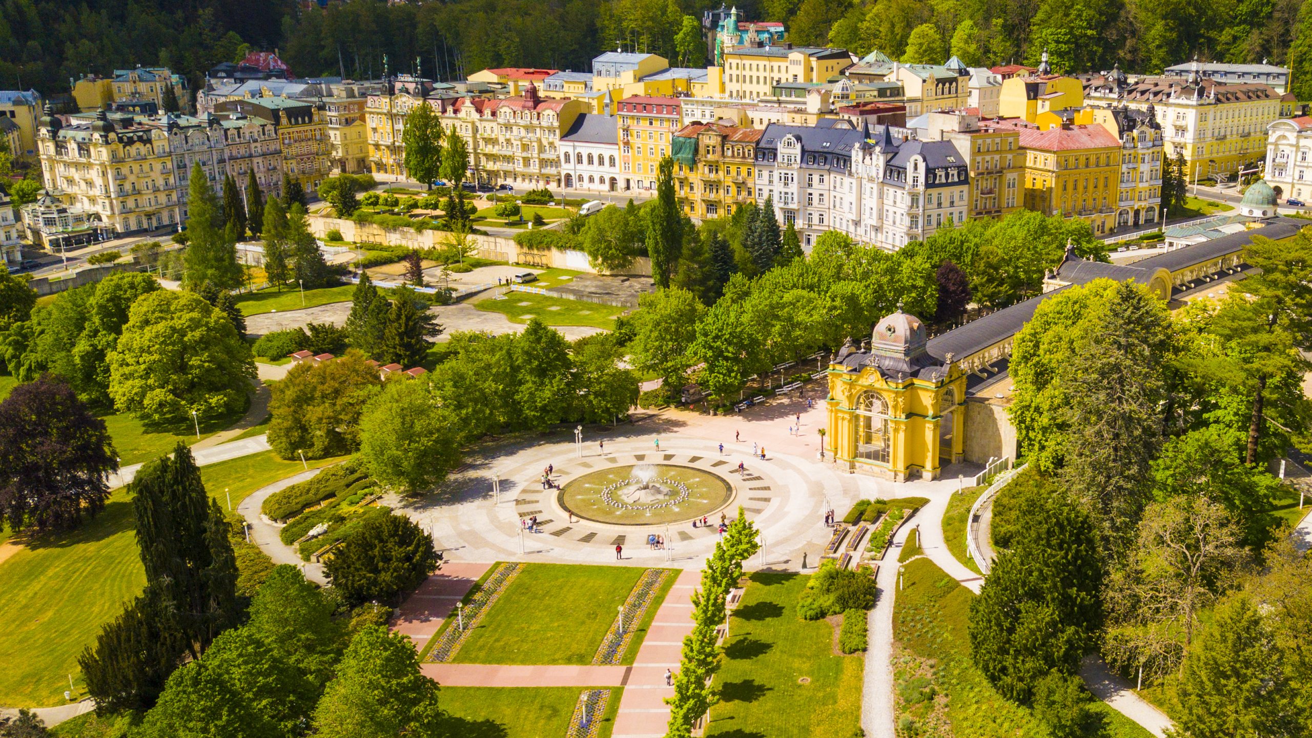 Aerial view of Marianske Lazne spa (Marienbad). Fountain in spa colonnade from above. Karlovy Vary Region of the Czech Republic, European union. Famous spa town with curative carbon dioxide springs.