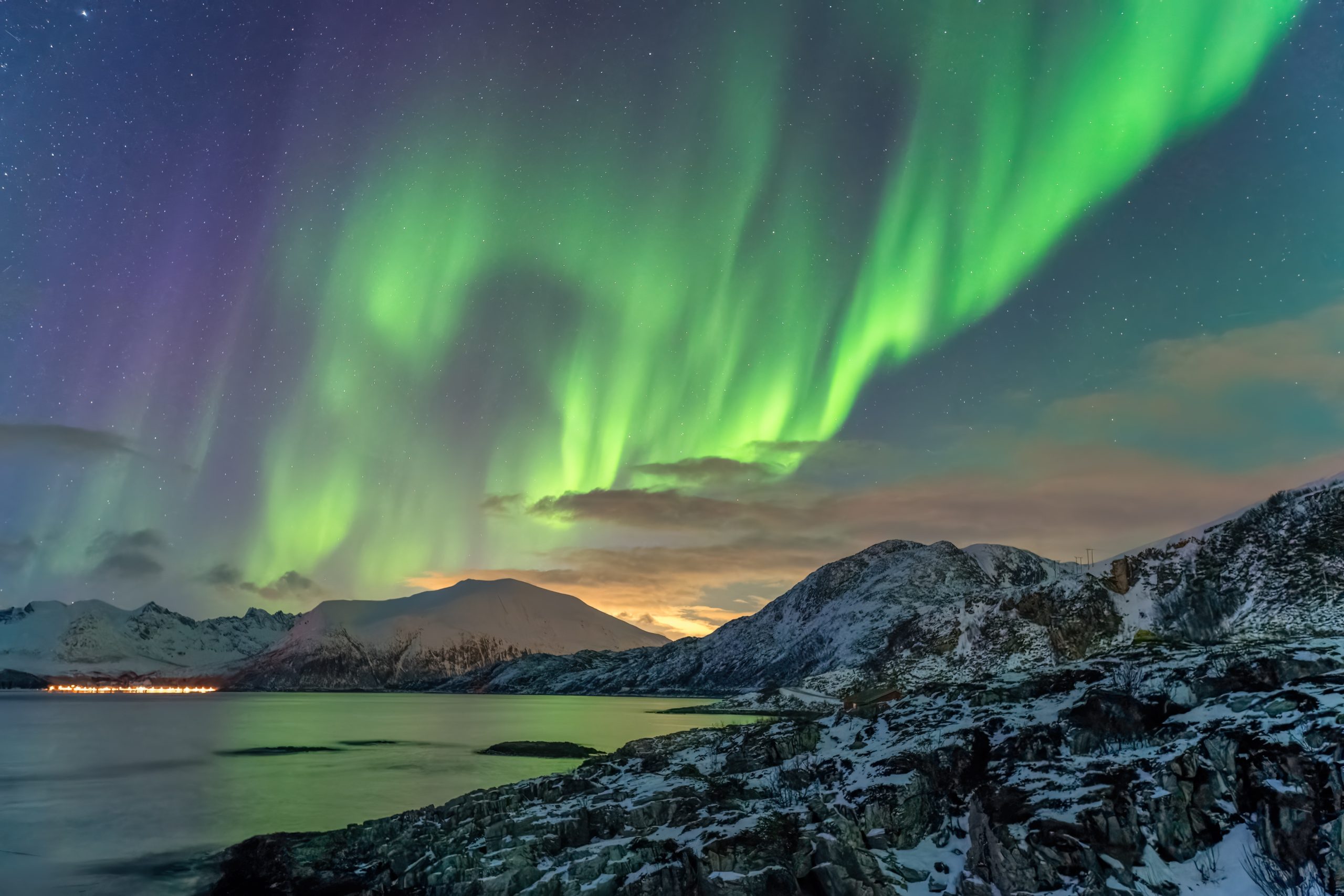 Tromso Norway, aurora borealis northern lights winter landscape at Rorvikneset Sommaroy
